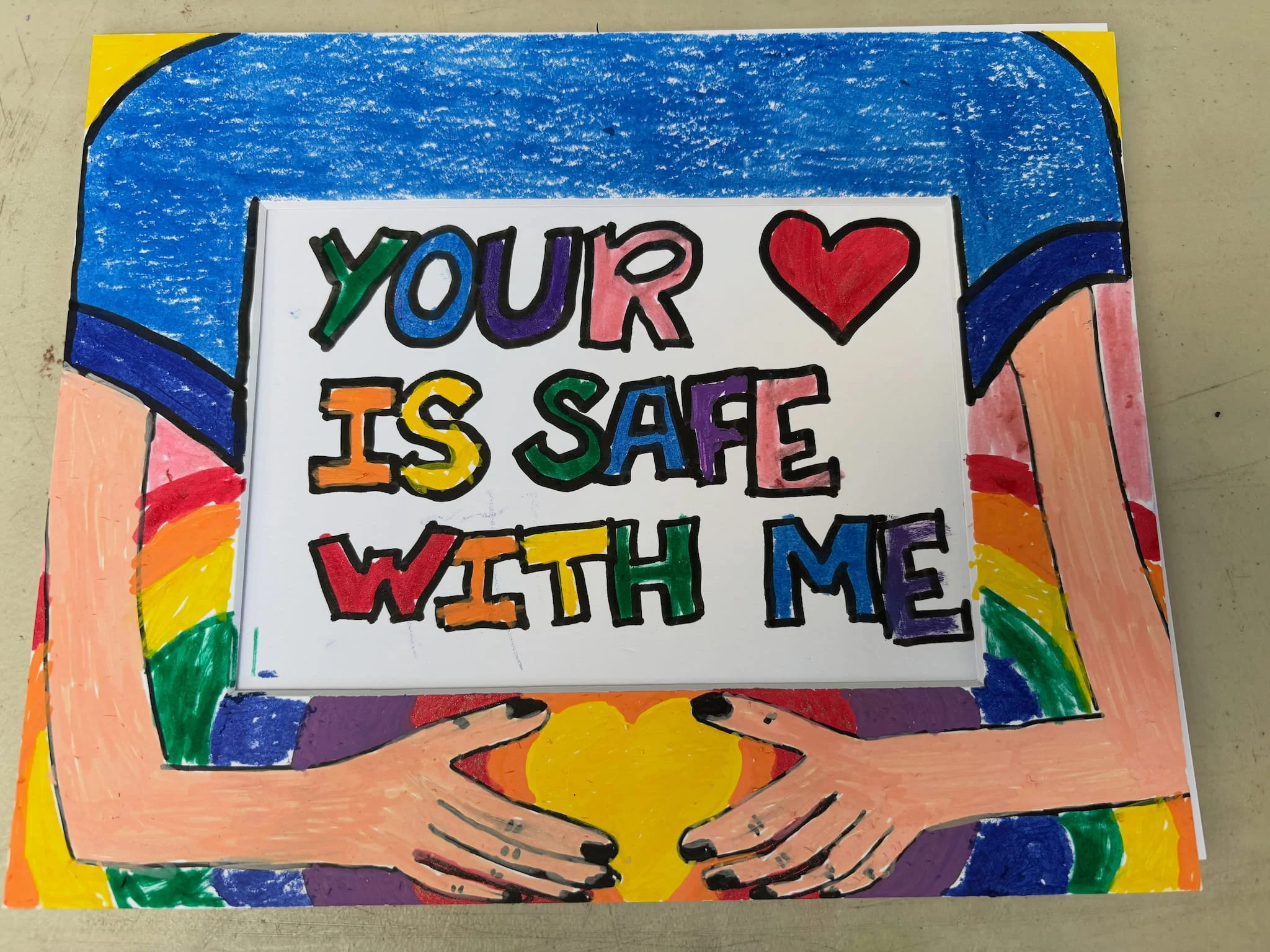 Painted healing frames displayed in a community affected by crisis