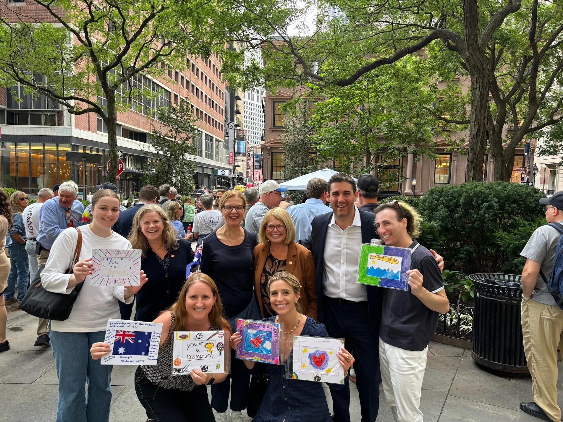 Community members reuniting at a long-term healing gathering