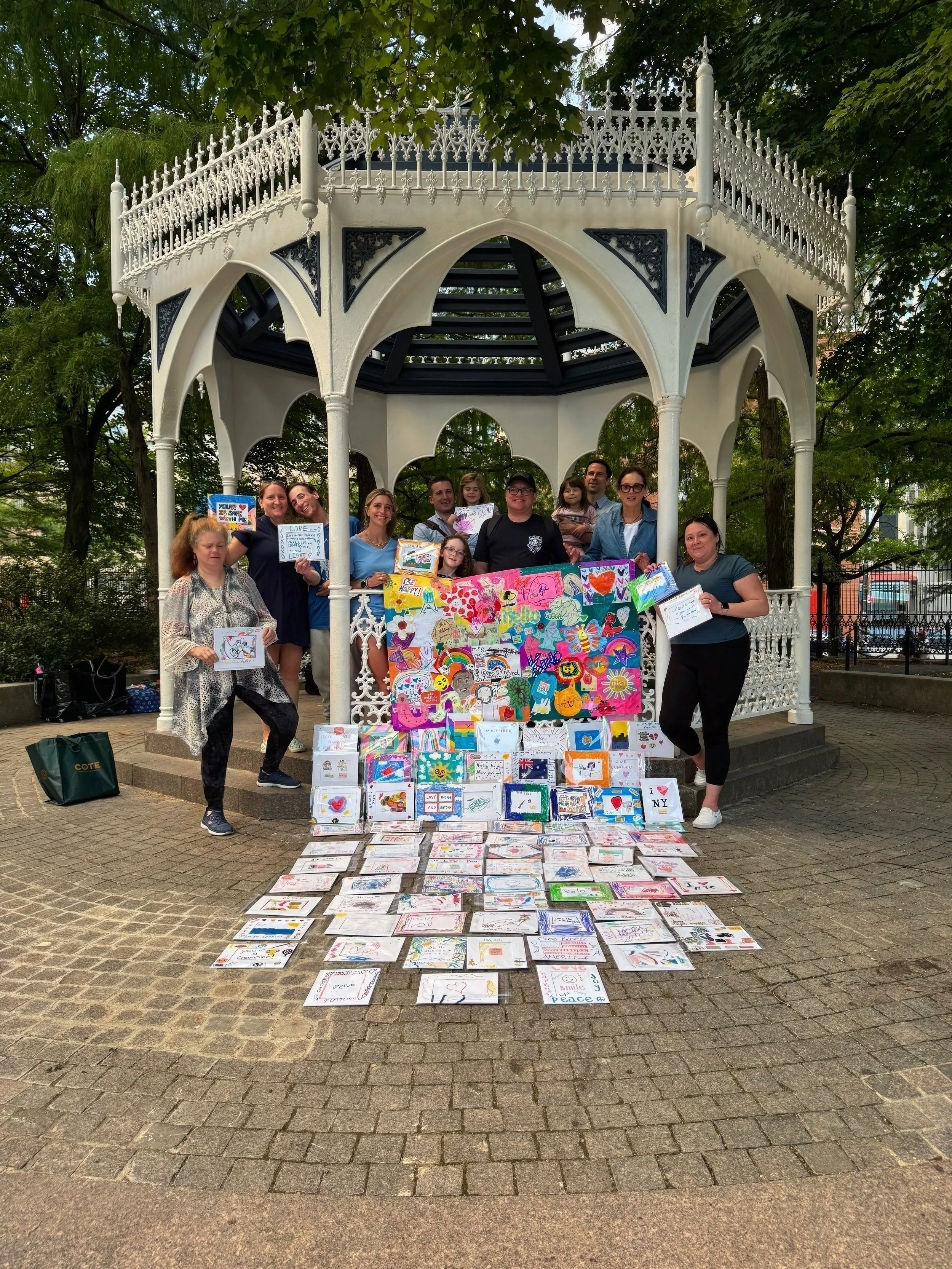 Hands creating art at a Frame Forward gathering