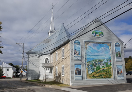 The sacristy of Neuville church showing the commemorative mural fresco