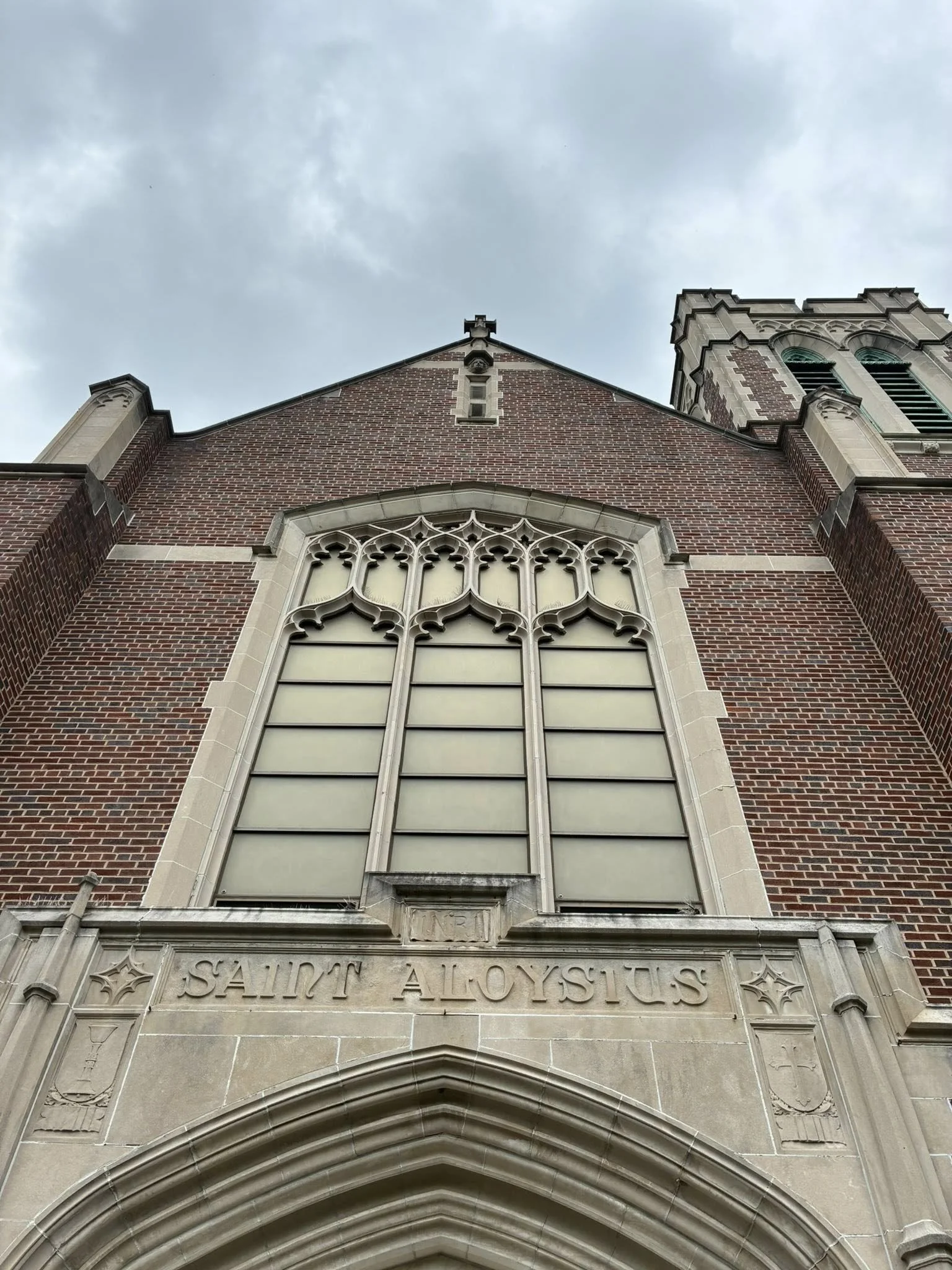 St. Aloysius Church facade showing French Gothic architecture with limestone details and tower