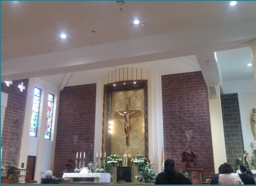 Exterior statue of saint on church wall