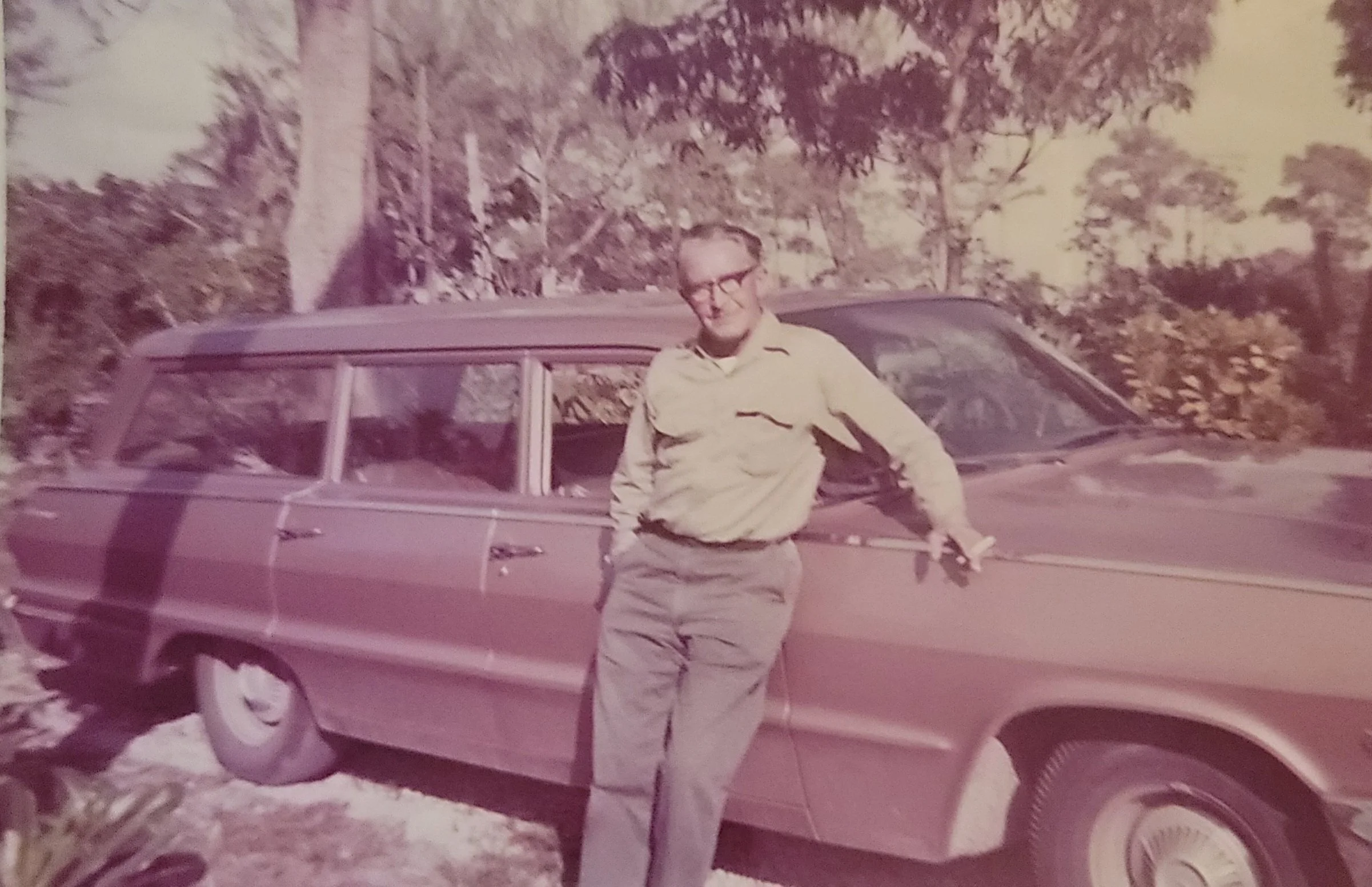 Thomas Eugene with his car