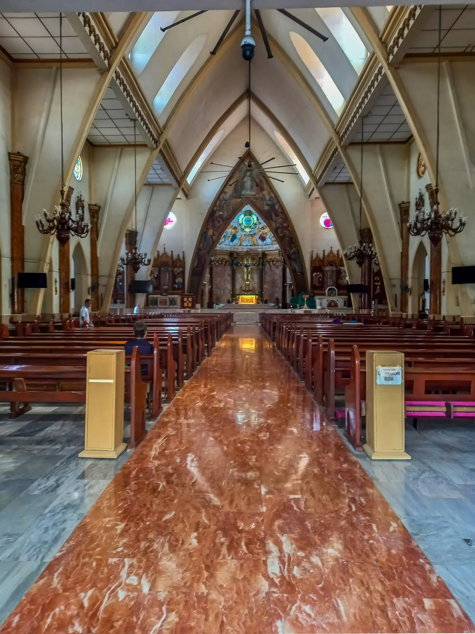 Interior of the Archdiocesan Shrine of Espiritu Santo, Manila, looking down the red marble aisle to the altar