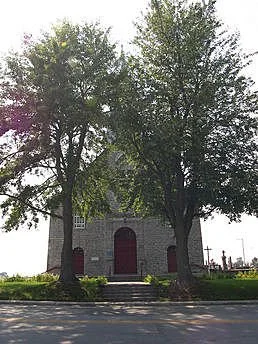 Église Saint-Paul with flowering trees
