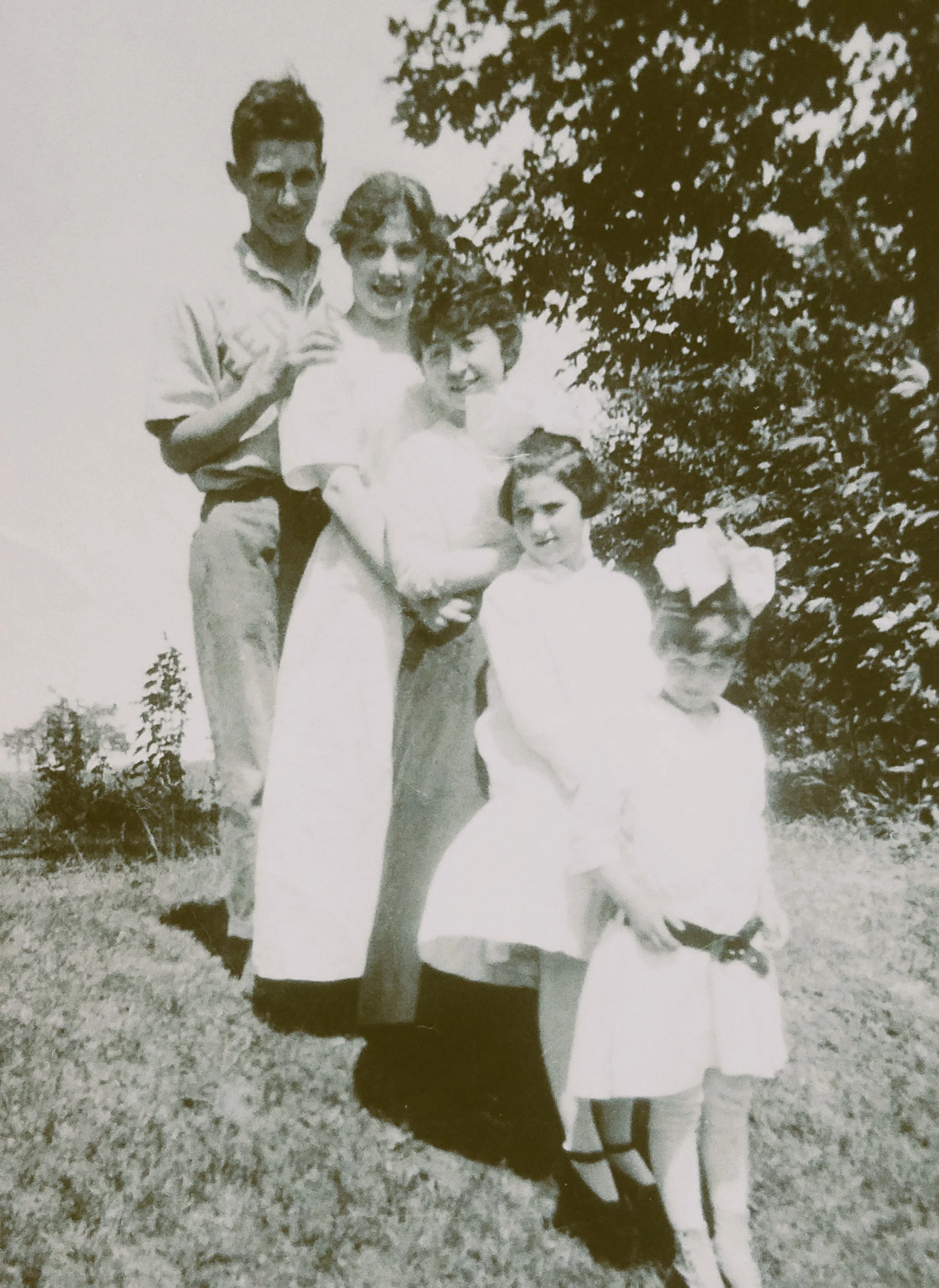 Jim, Eleanor, Anna Moran Stone, Mary and Margaret Kenny lined up on a hillside