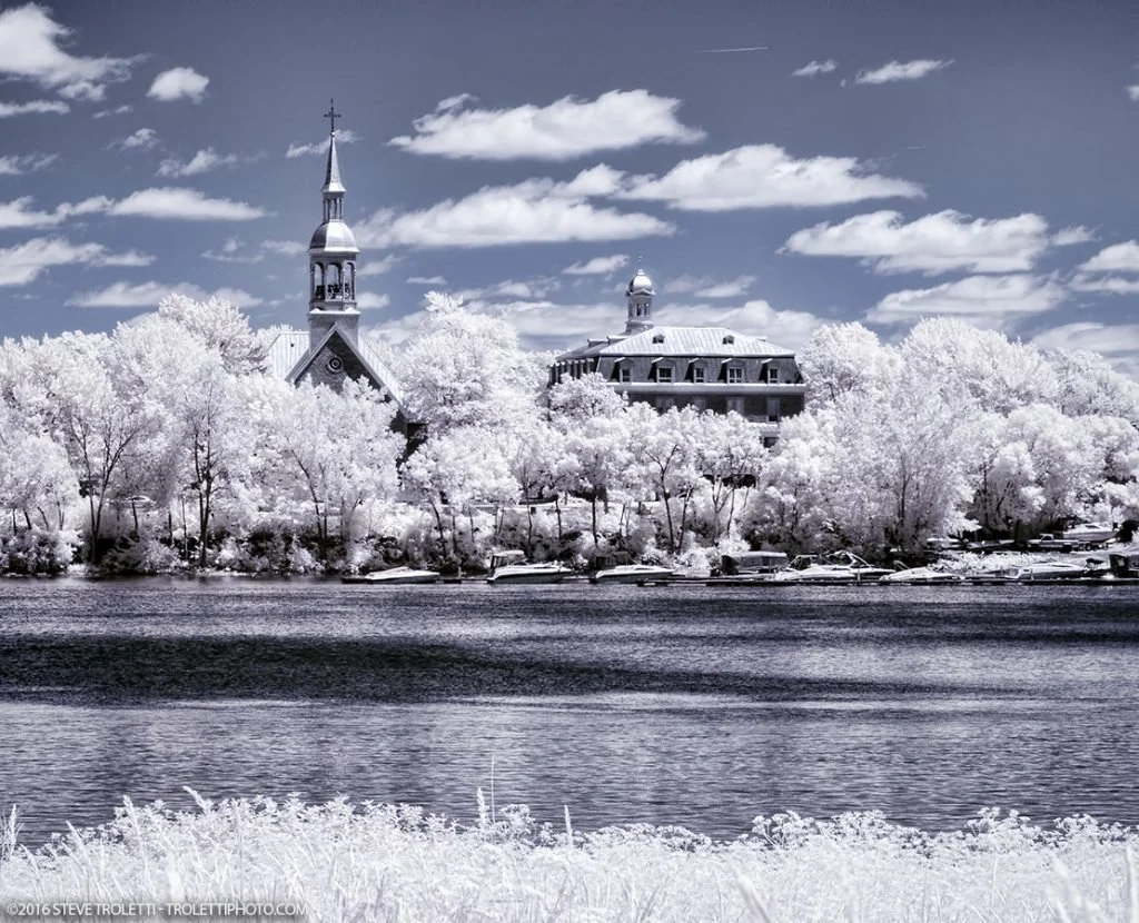 Sainte-Famille Church and the former convent seen from the Îles-de-Boucherville, infrared photograph