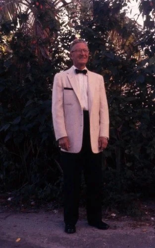 Thomas Eugene in white tuxedo