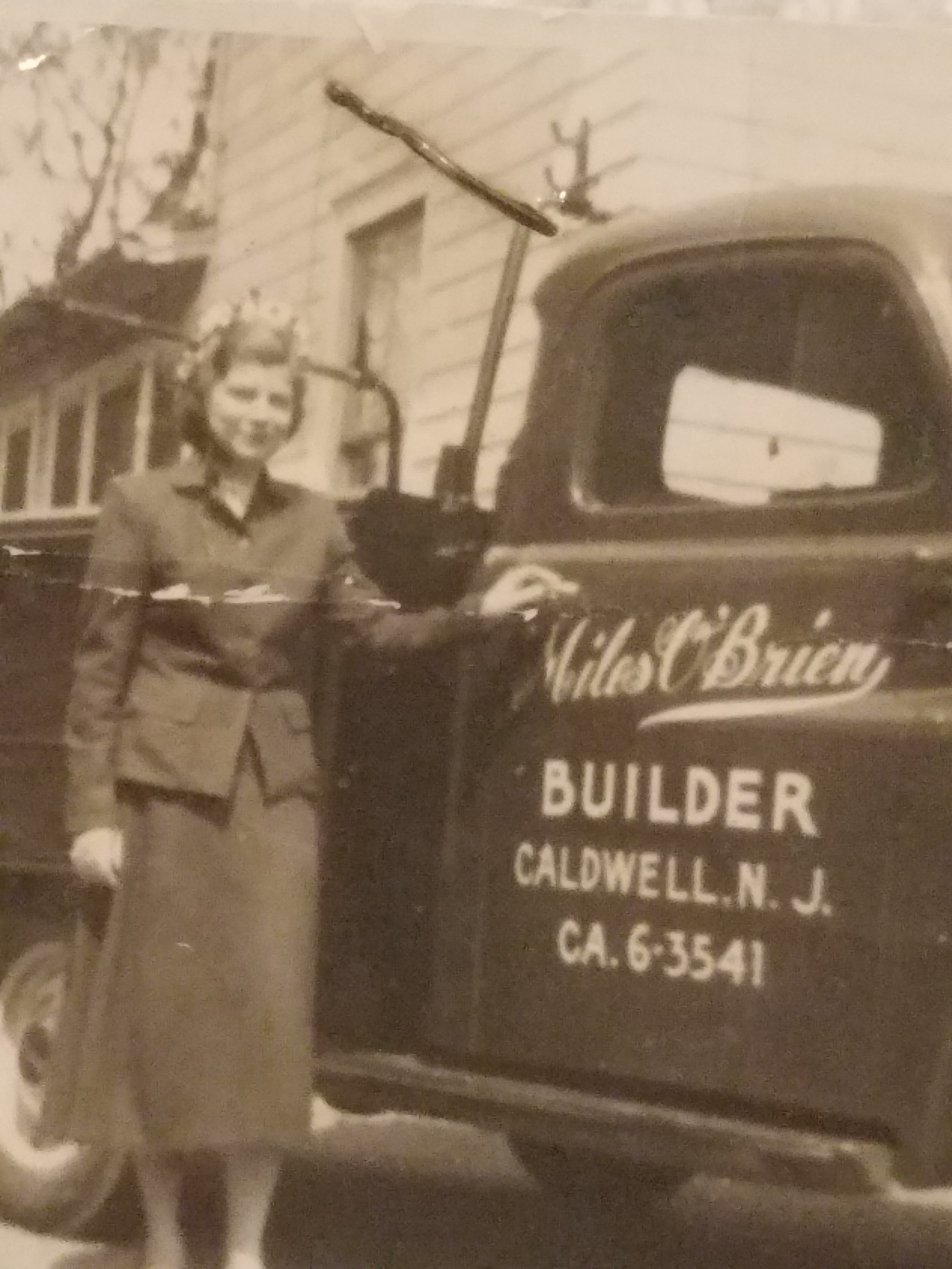 Lillian beside her father's truck