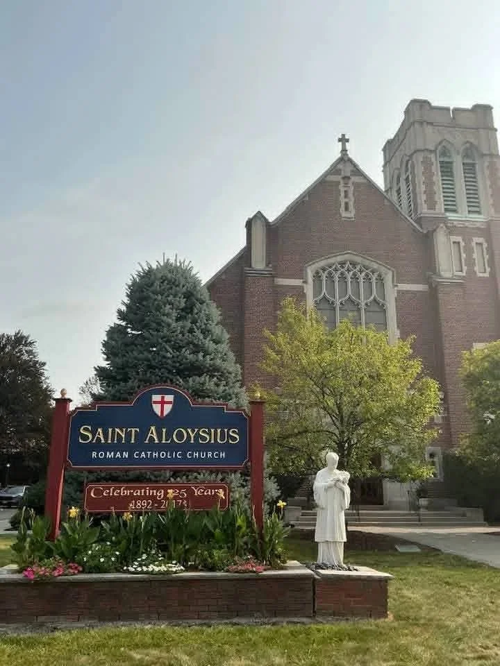 St. Aloysius Church exterior with anniversary sign