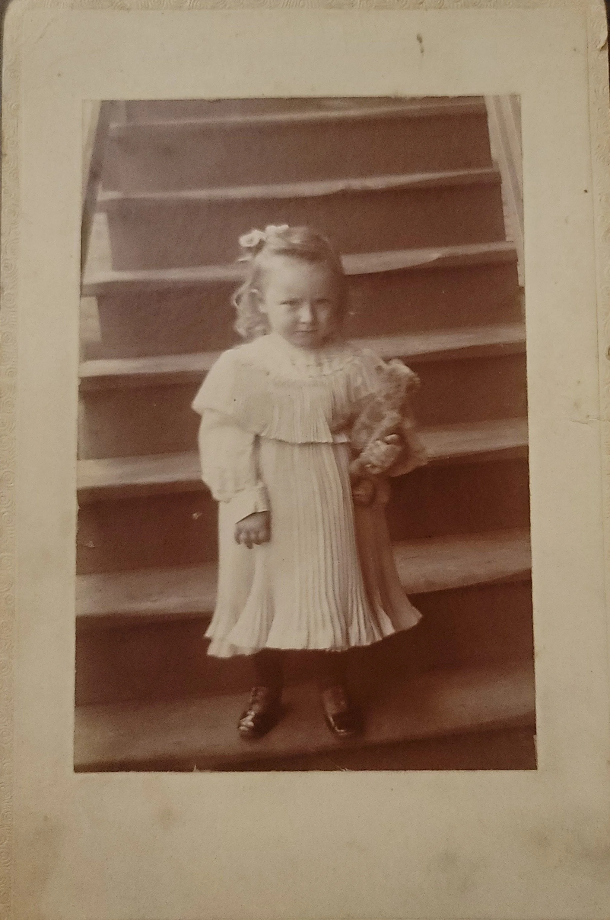 Unknown child with teddy bear, c. 1917