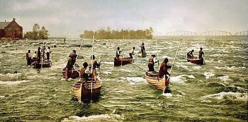 Ojibwe fishermen navigating the St. Mary's Rapids in birchbark canoes, circa 1901