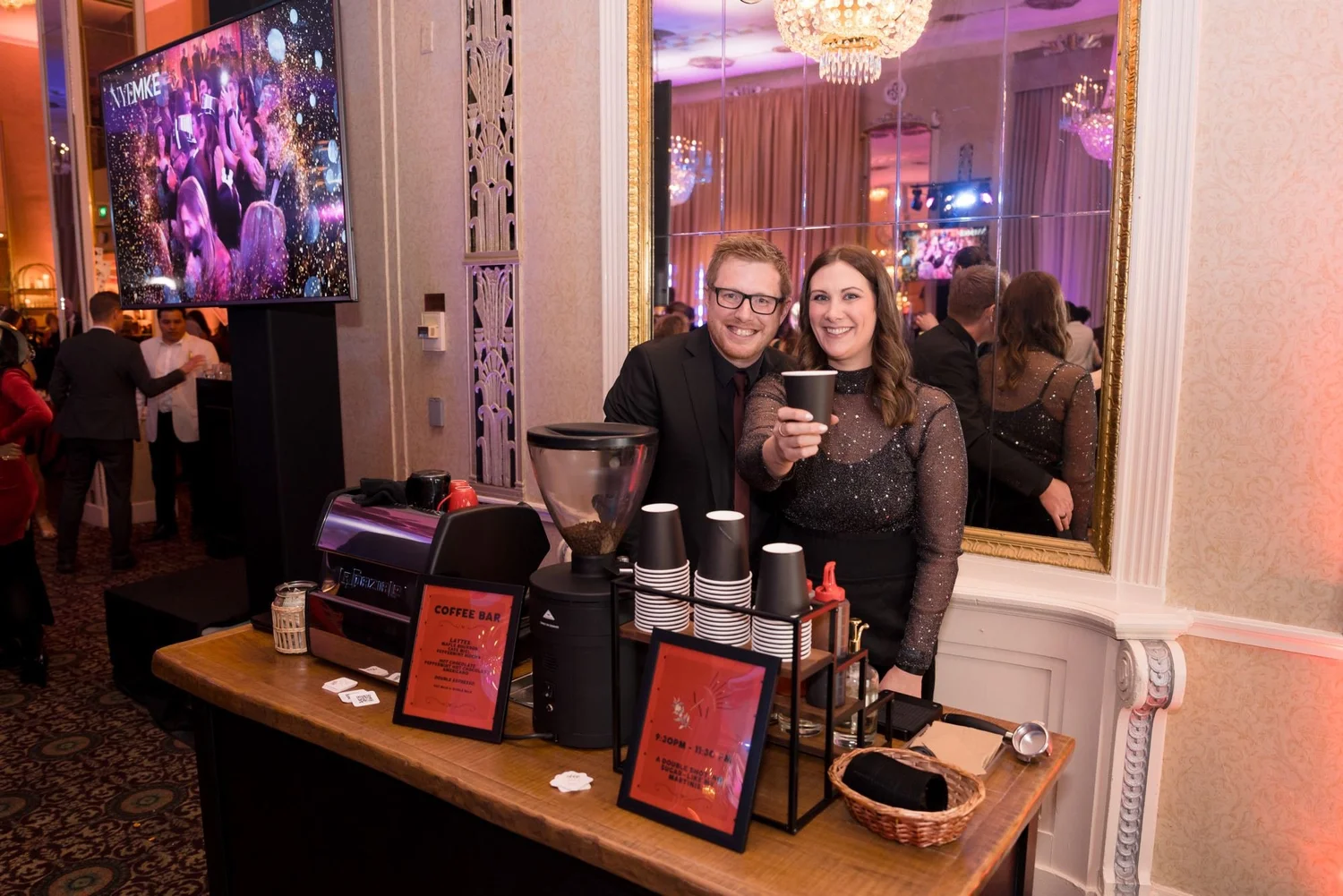 AM Coffee Co espresso bar in a ballroom at a Milwaukee New Year's Eve gala, with baristas and guests