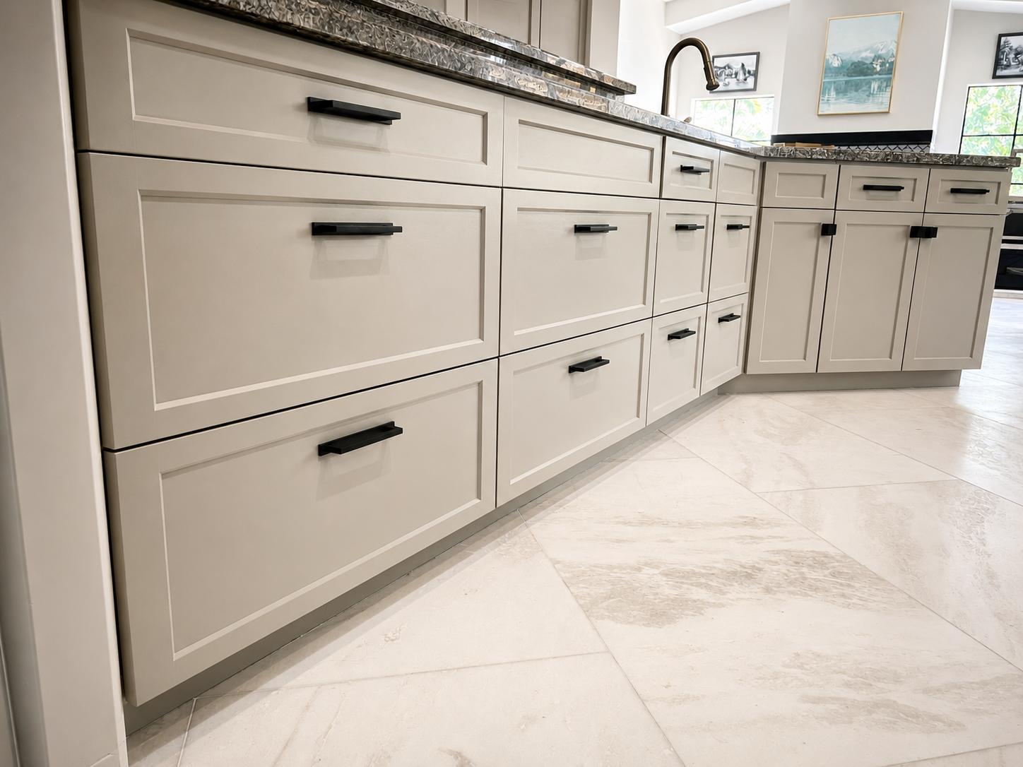 Light gray shaker cabinet drawer fronts with matte black pulls