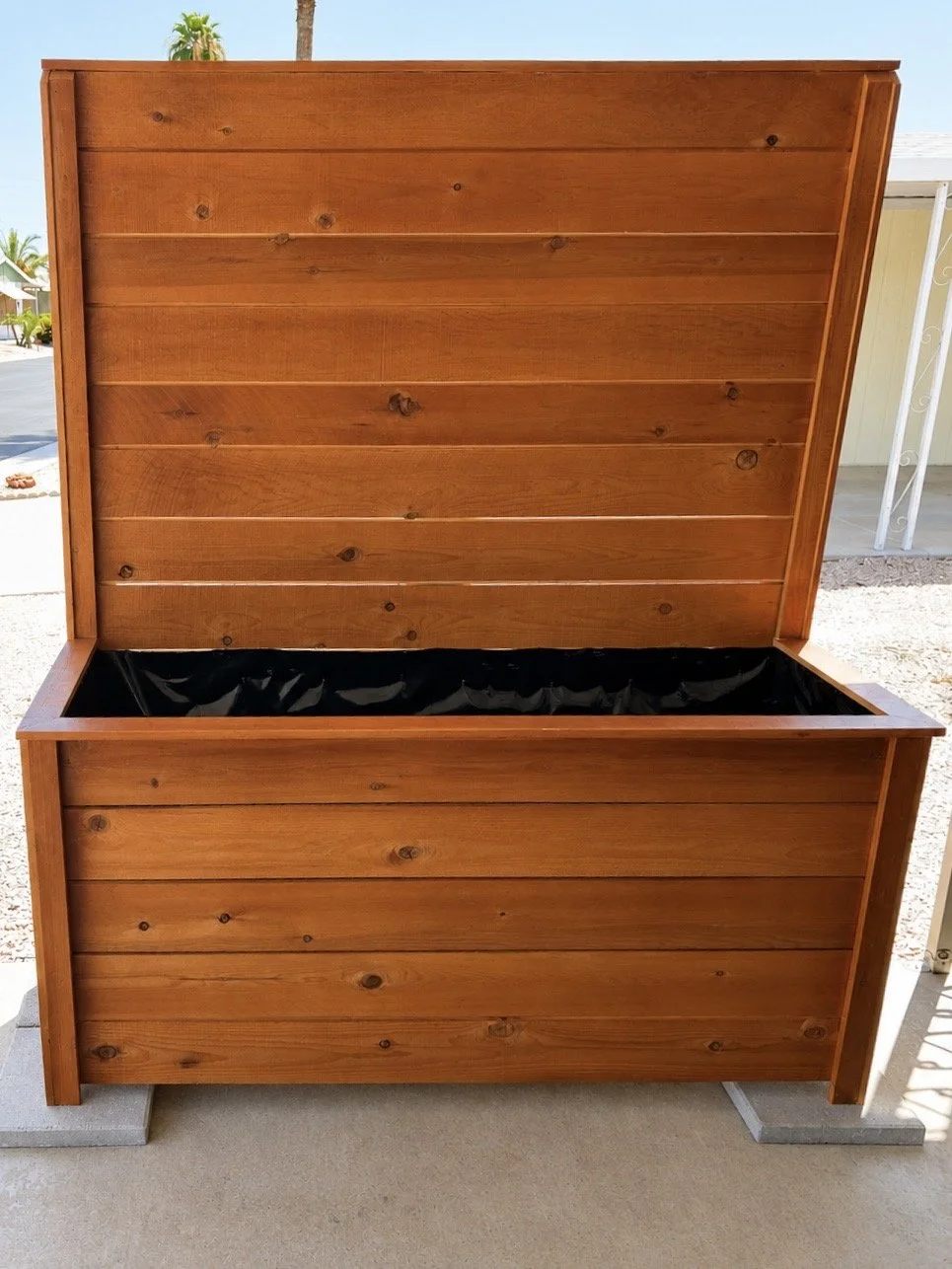 Large stained cedar planter box with a privacy panel
