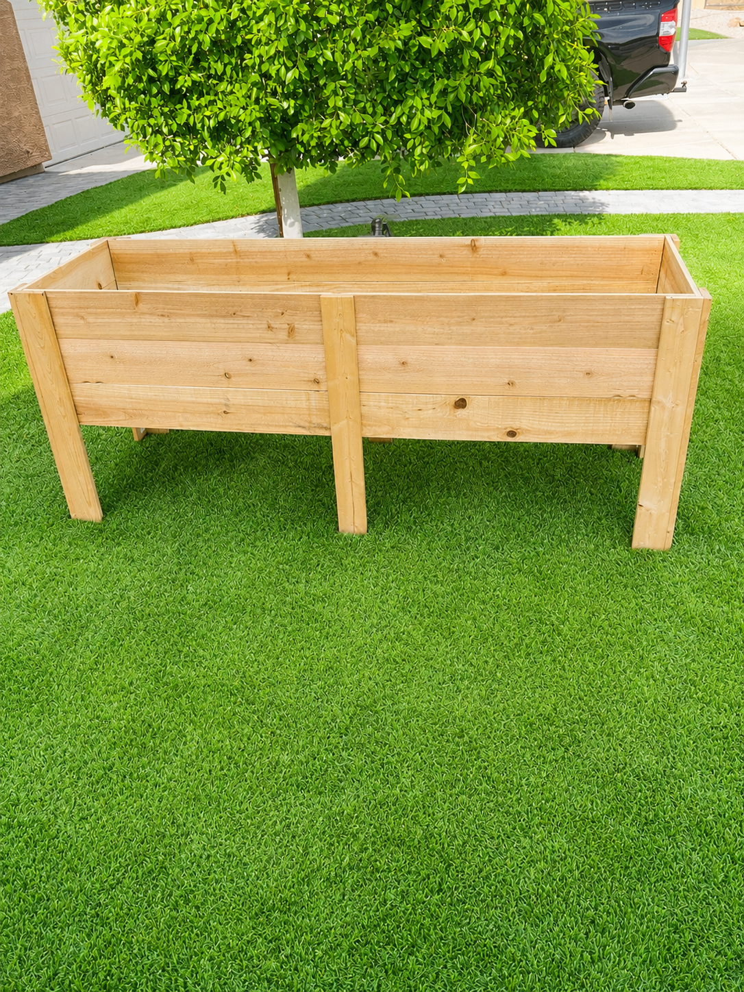 Raised cedar garden planter box on turf