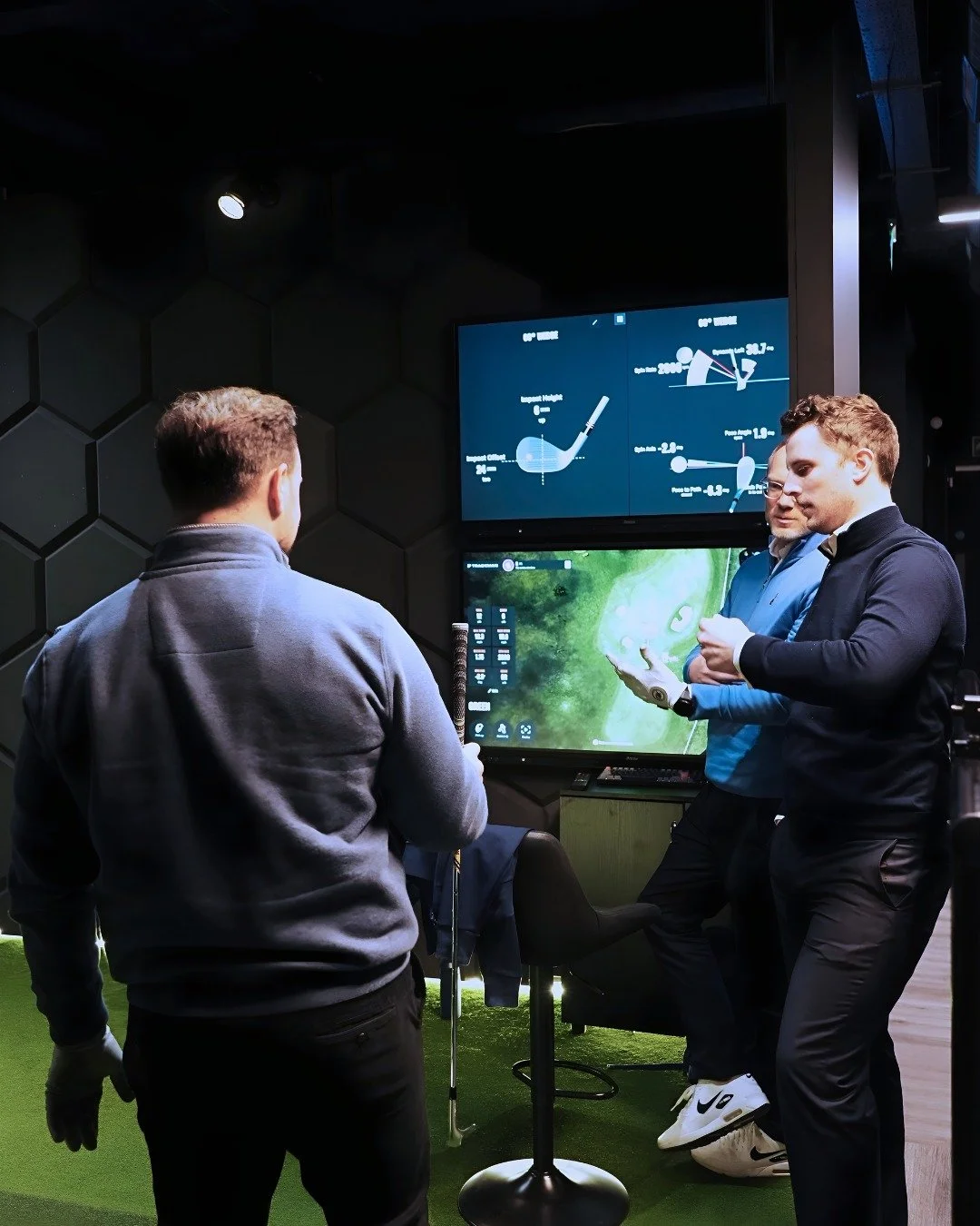 Coach reviewing swing data with client