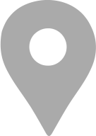 A small, grey location pin icon.
