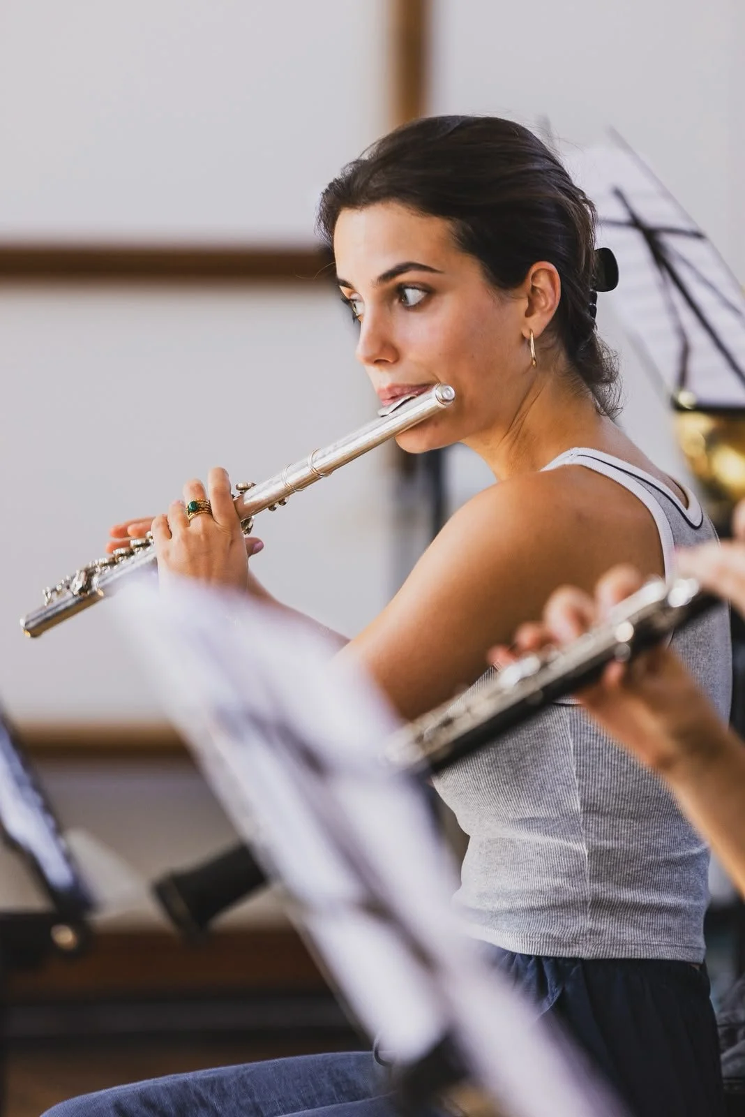 Flautist playing during rehearsal