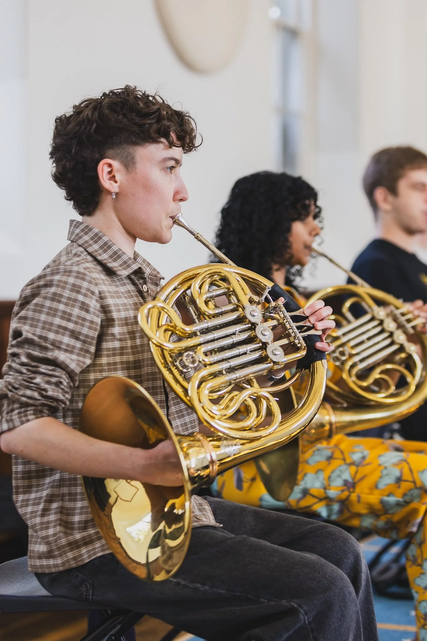French horn players rehearsing