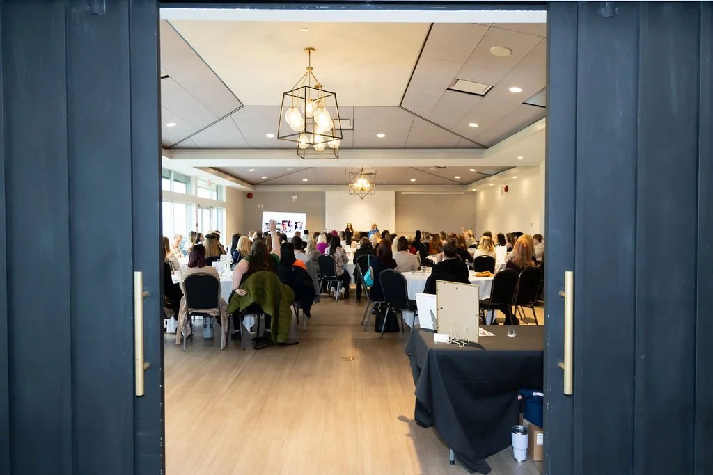 Doors opening onto the full breakfast room at a Female Forward Collective monthly breakfast