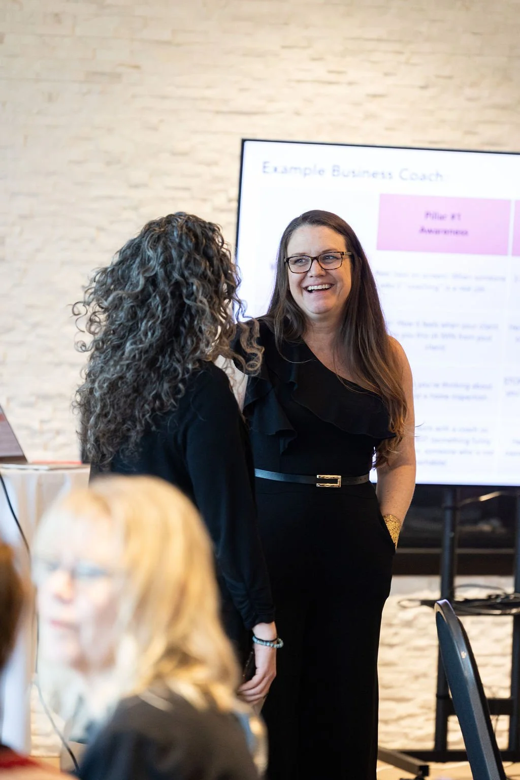 Meghan Simington chatting with attendee