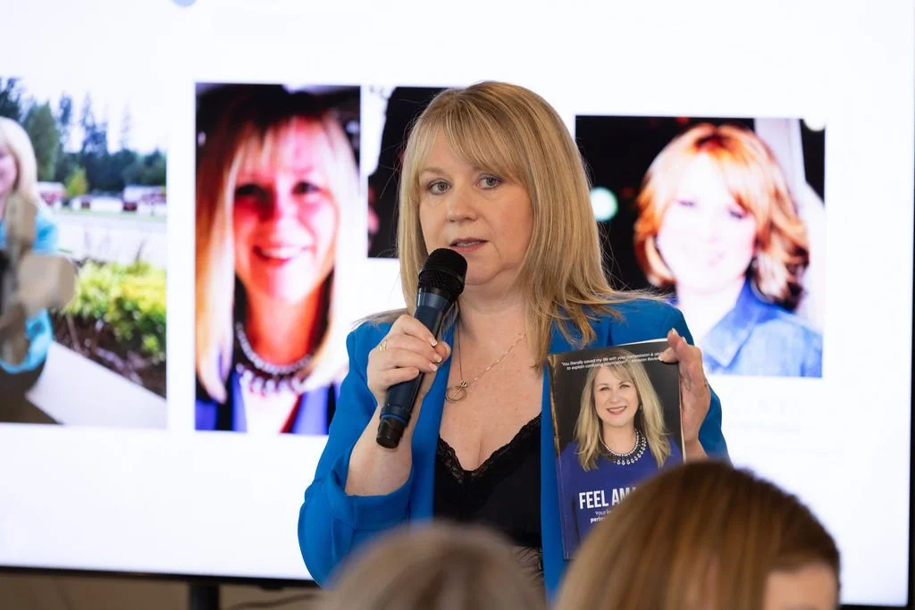 Shirley Weir holding her book Feel Amazing while speaking