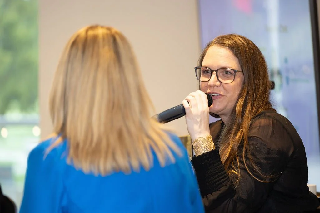 Meghan Simington facilitating a fireside chat at a Female Forward breakfast