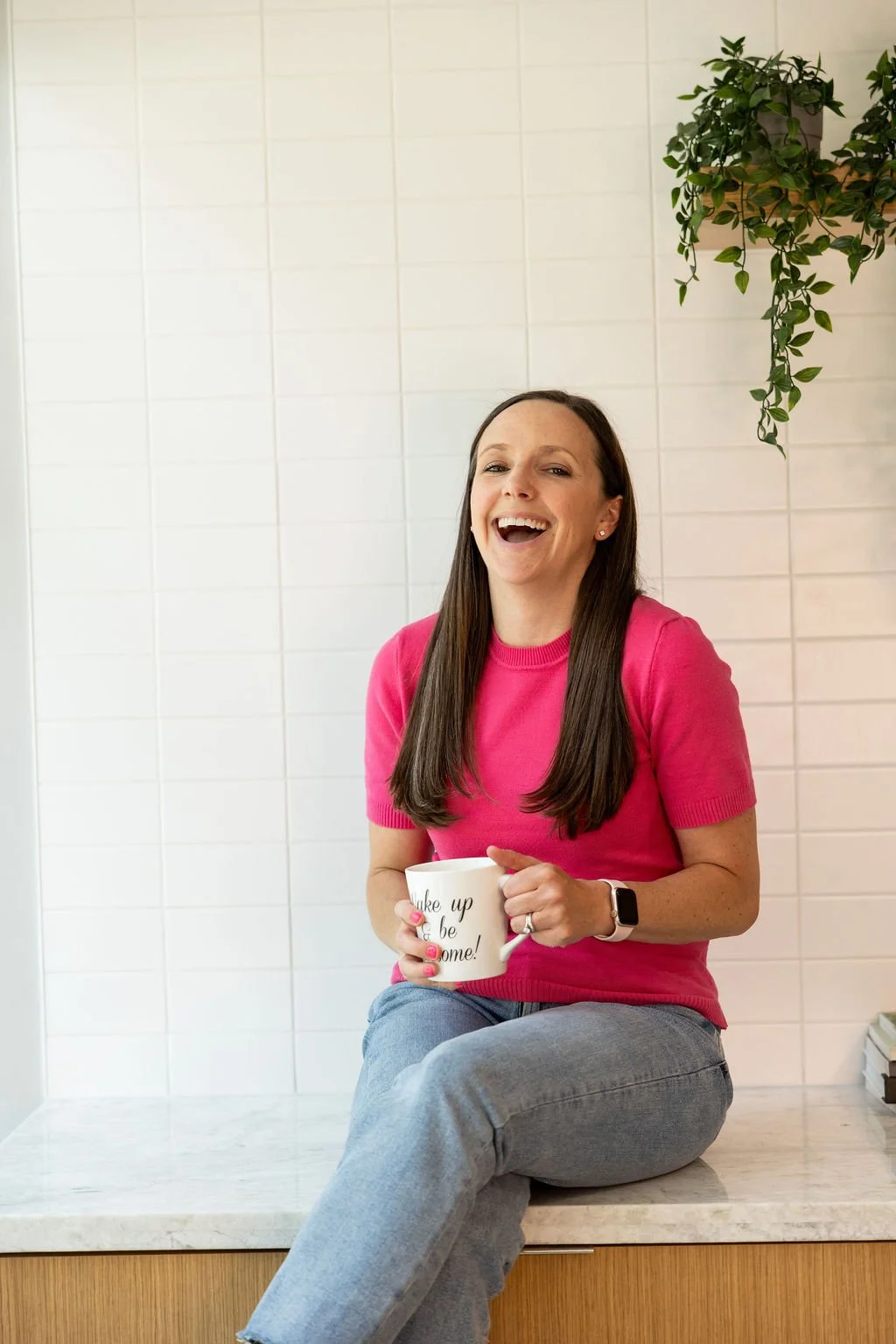 Jen on the counter, mug in hand