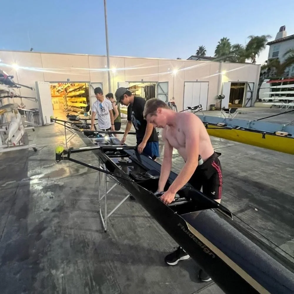 The varsity adjusts foot stretchers in the John O'Donnell Fluidesign for its first row