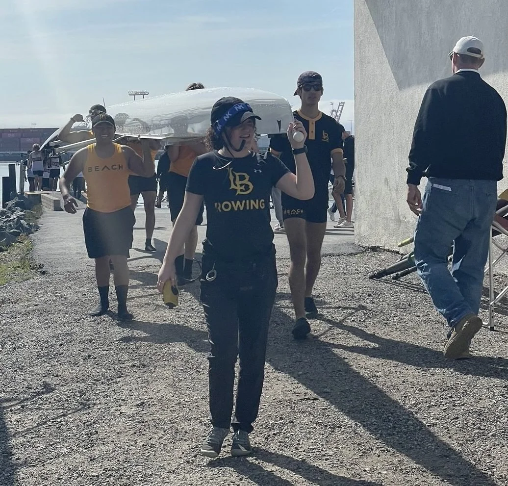 The novice four boat returning after their race.