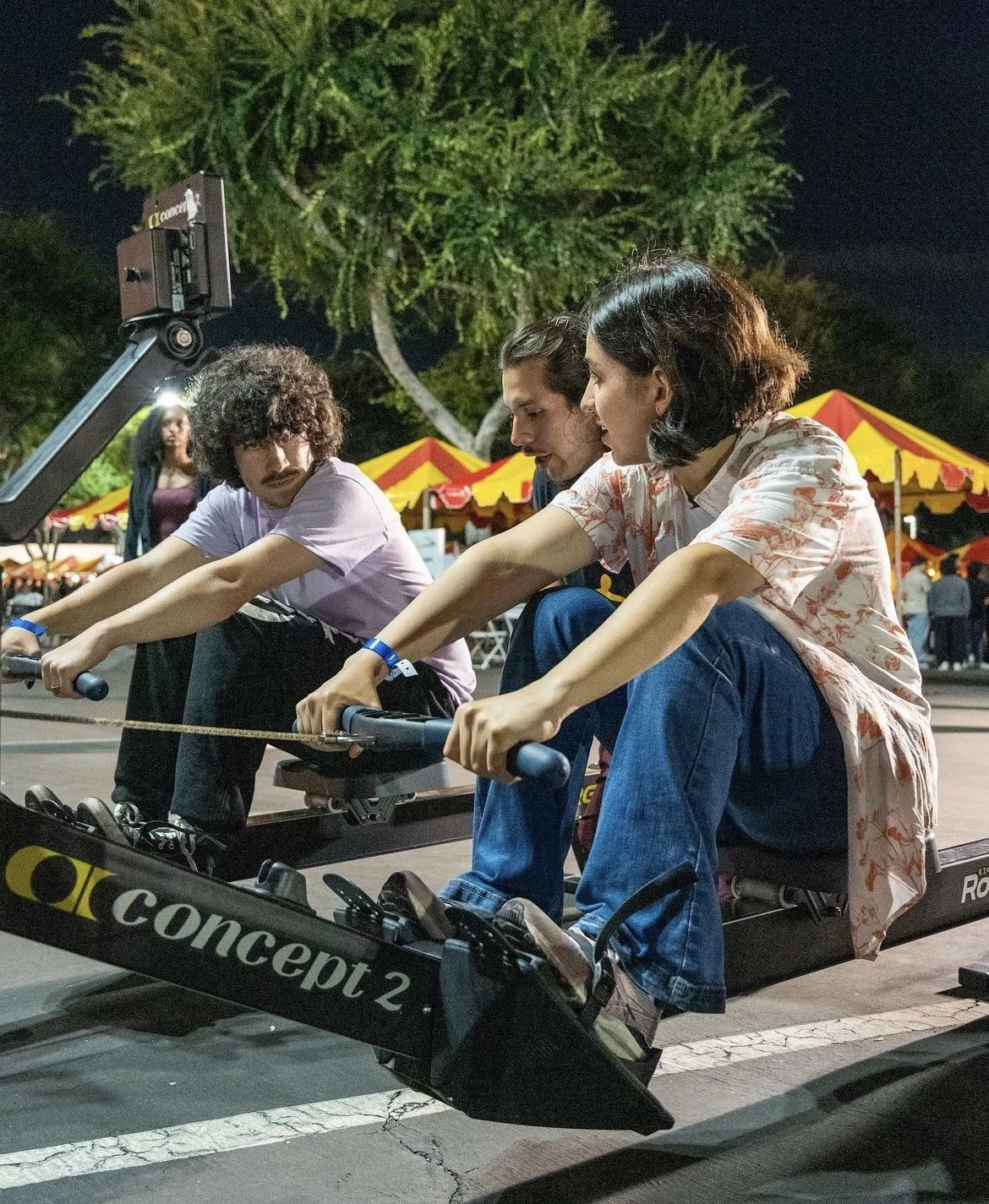 Alejandro Juarez gives pointers to students on the erg.