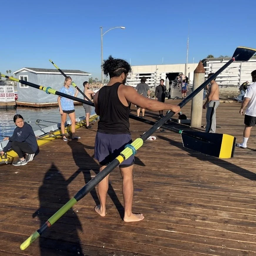 Novices put away oars after practice.