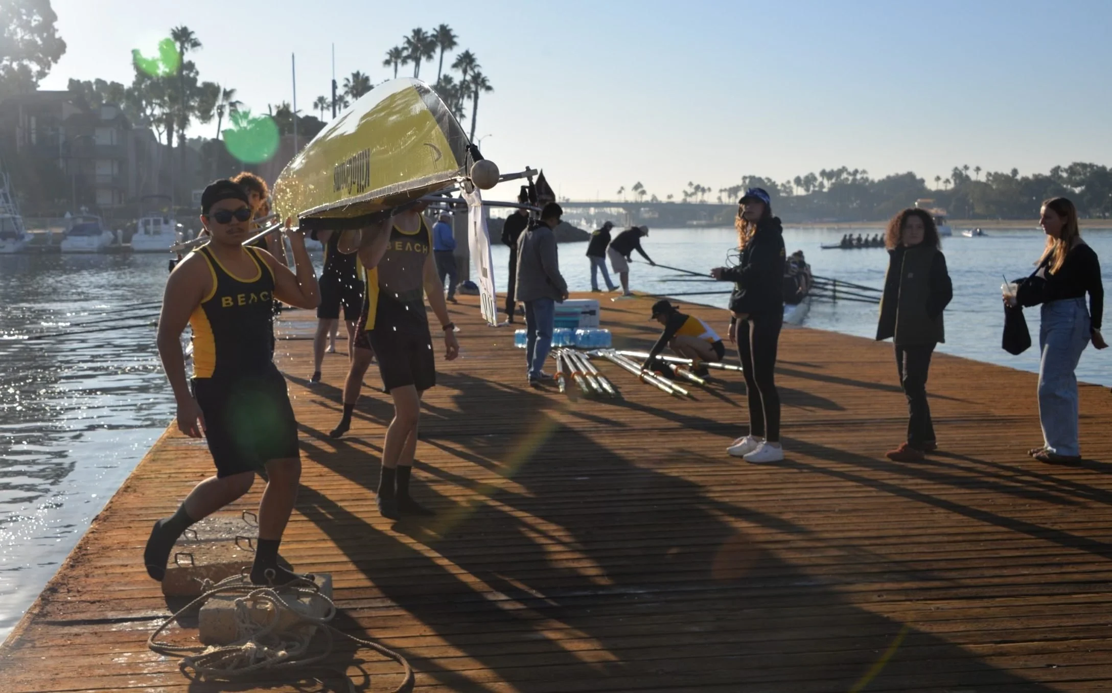 Men’s Varsity take their boat up to the wash deck after their race.