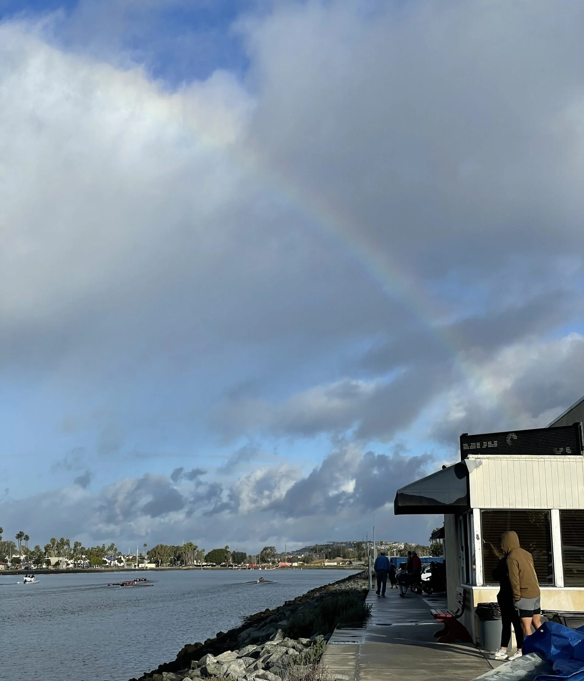 A rainbow peeks through the clouds on scrimmage day.