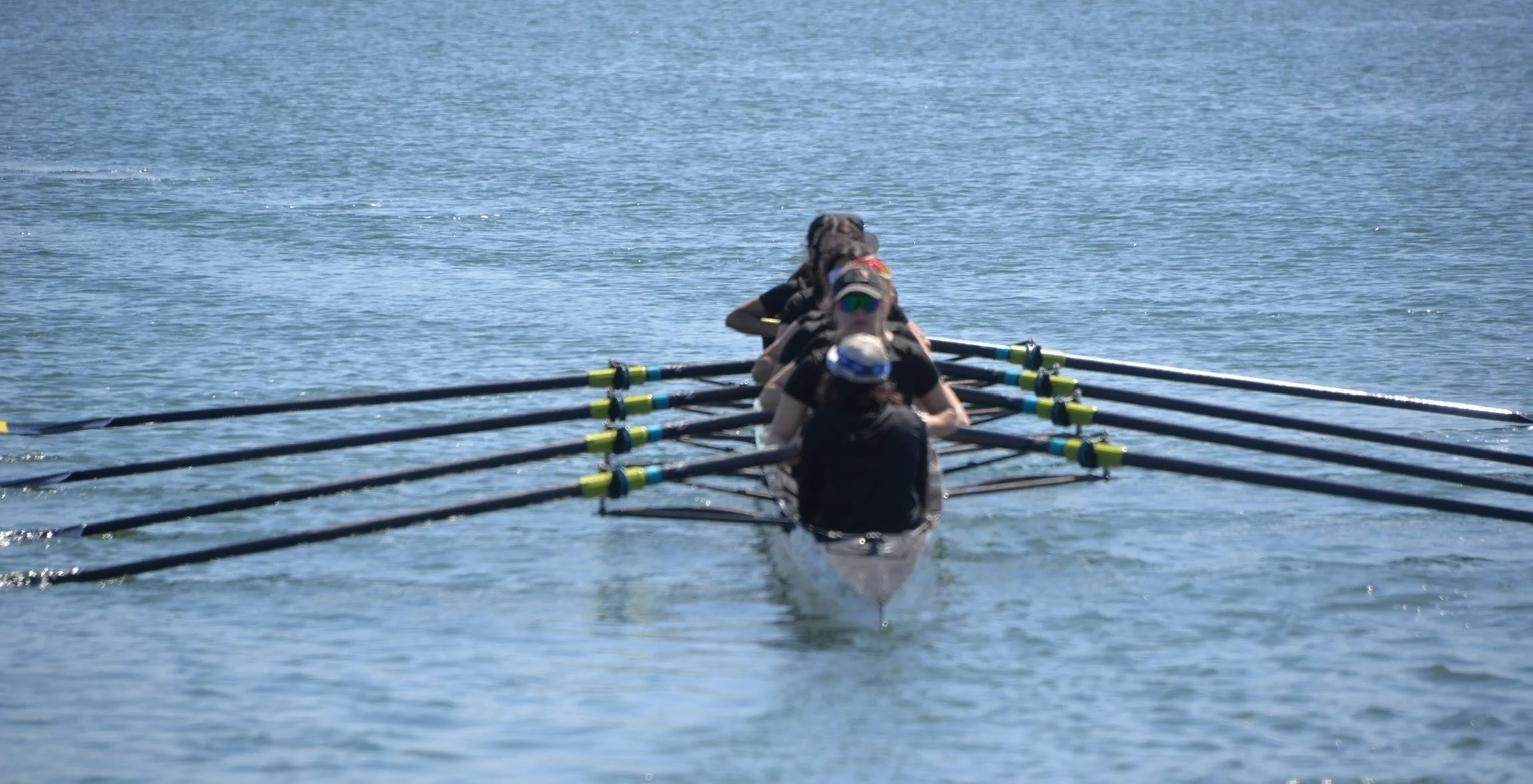 The Women’s Boat rowing towards their race start.