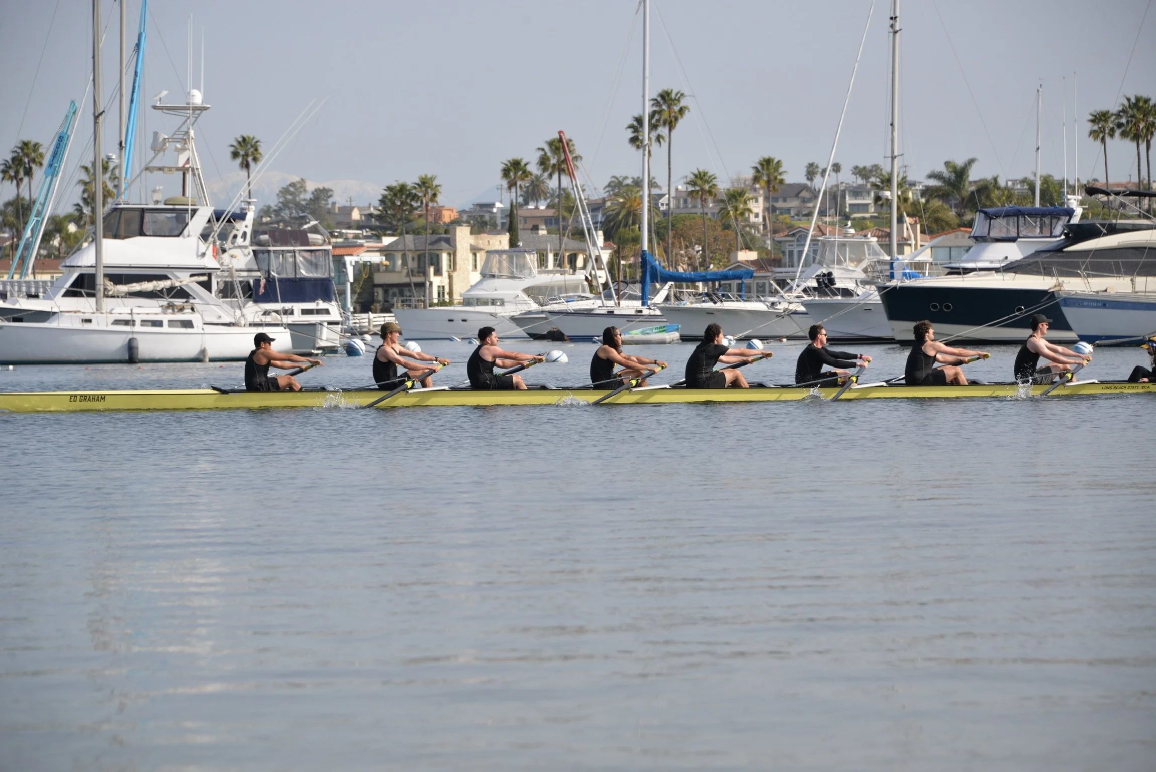Beach Crew mixed boat racing in the Newport Harbor.