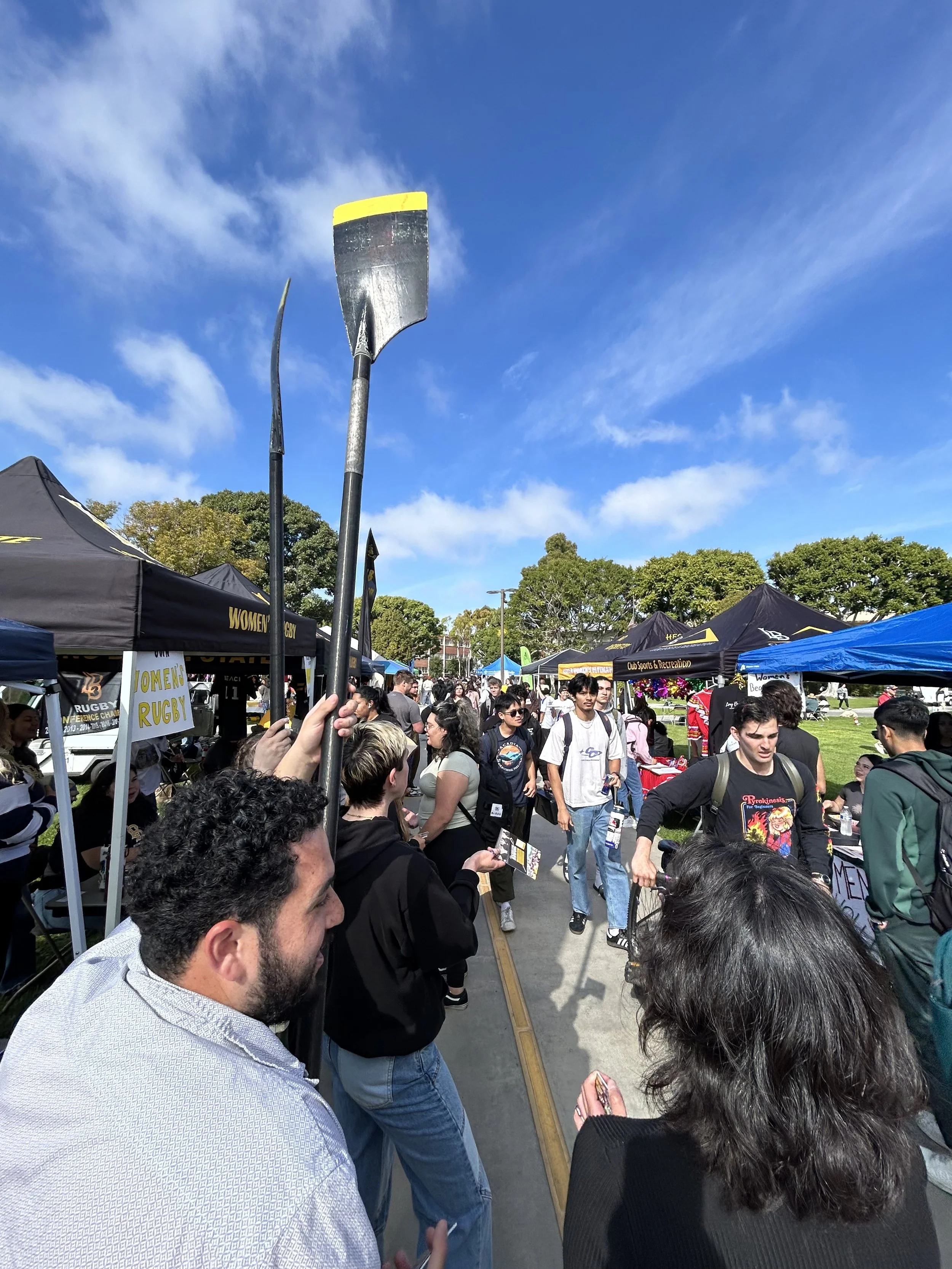 Second Photo: Beach Crew club members show off their posters and Beach Crew spirit. 