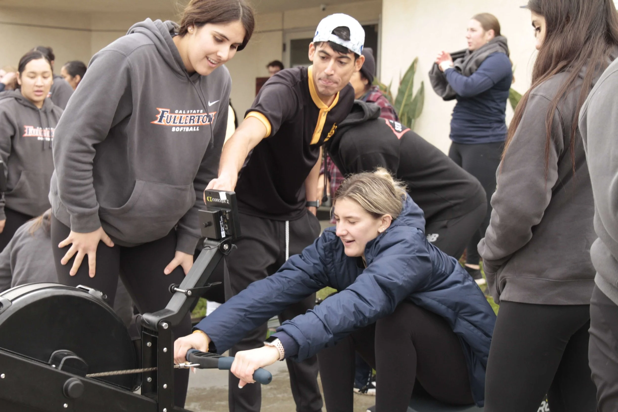 Ron instructs the CSUF Softball team on the ergs. 