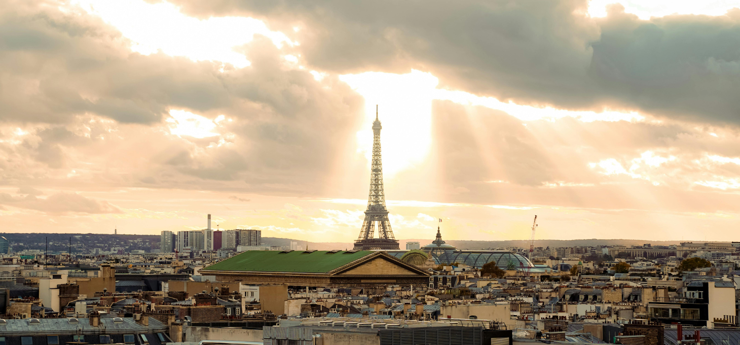 Paris honeymoon itinerary — bistro terrace at dusk by The Itinerary Architect