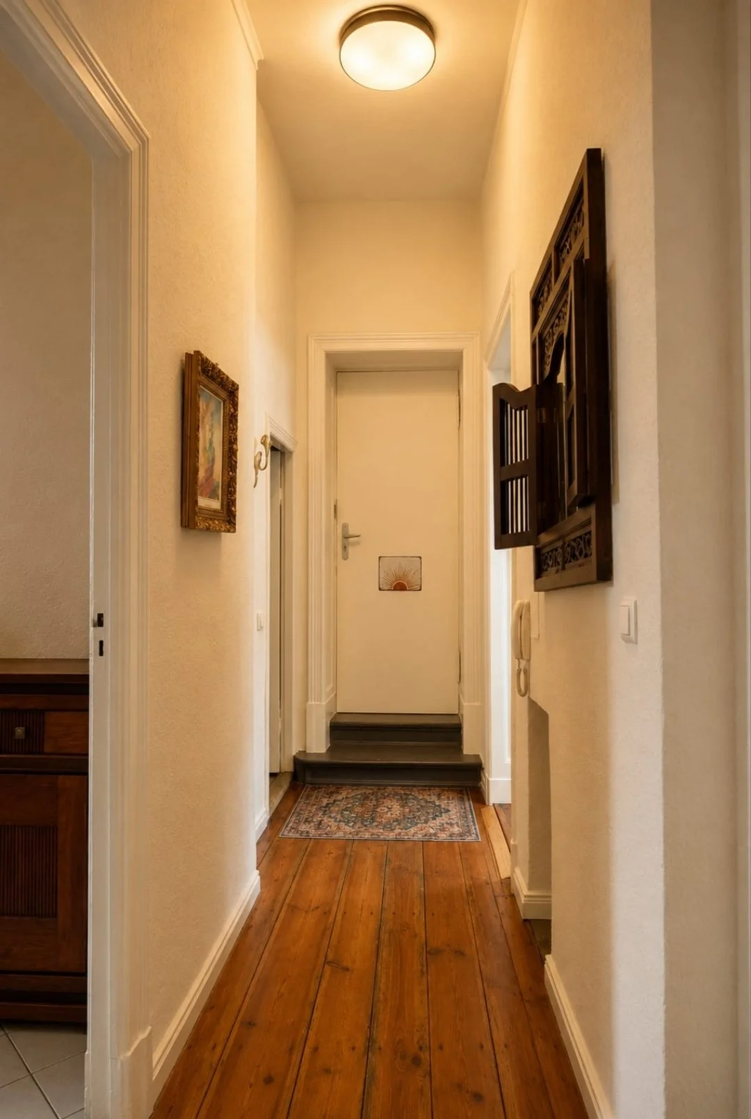 Hallway with original wooden floorboards and vintage details