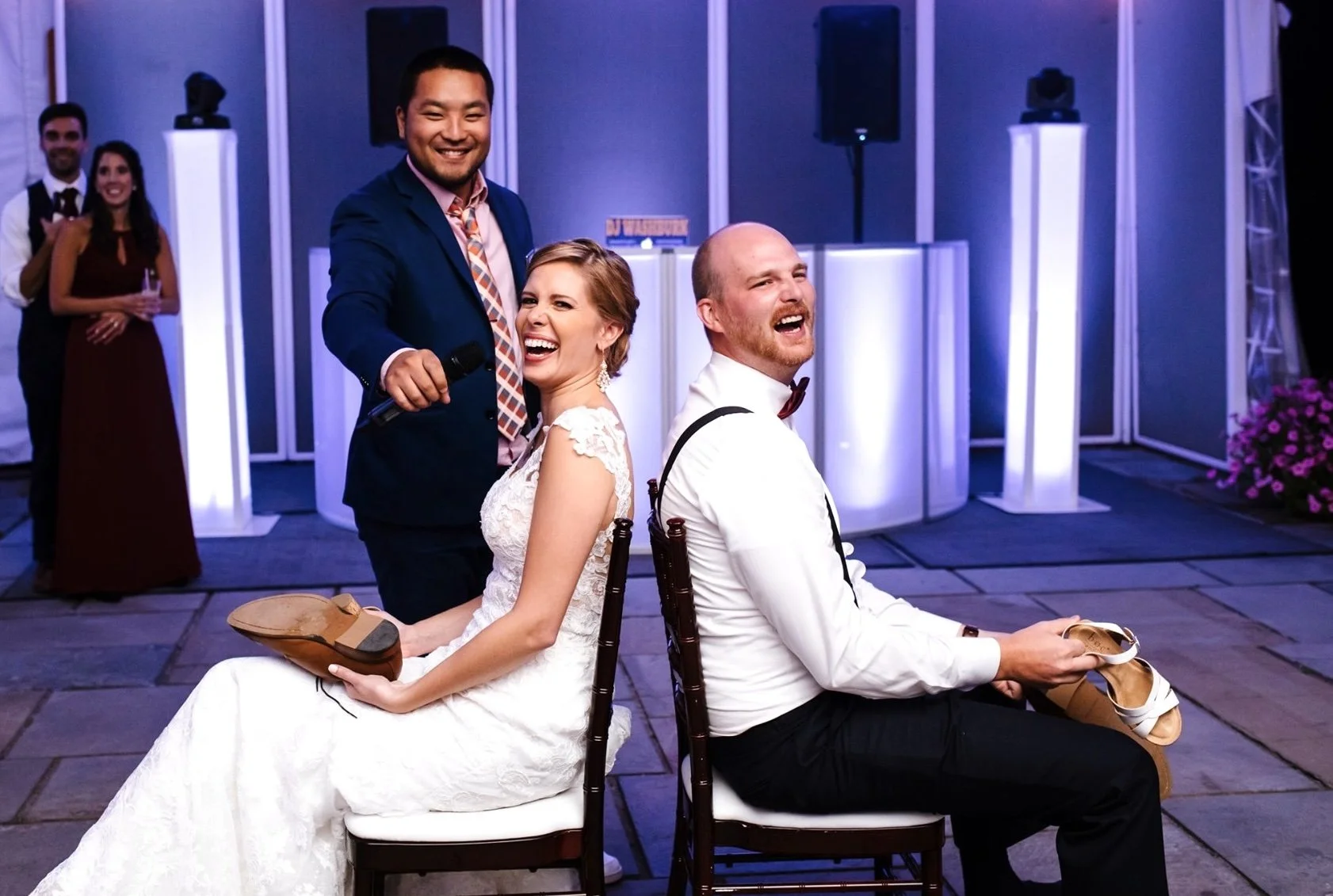 DJ Washburn celebrating with a wedding couple