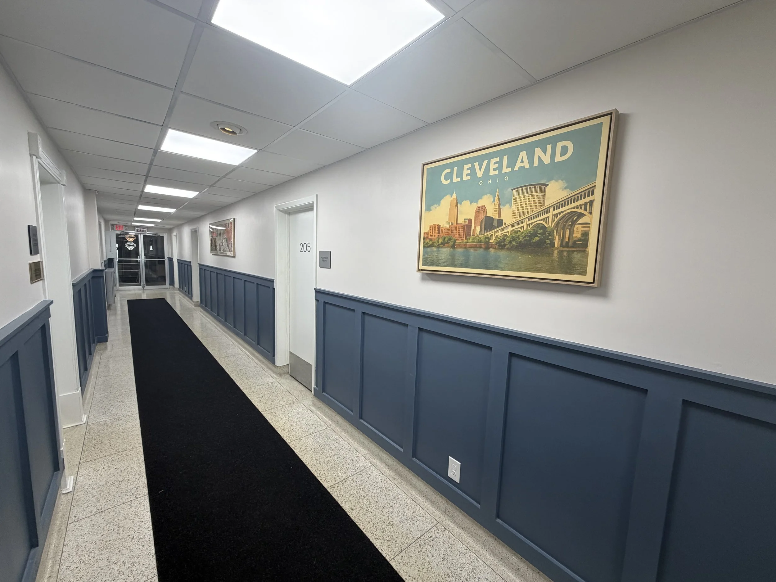Renovated common hallway at 5579 Pearl Road with Cleveland artwork