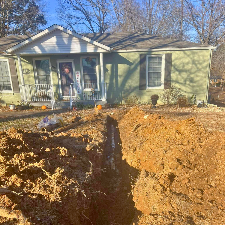 Main water and sewer line replacement trench at a Paris, TN home