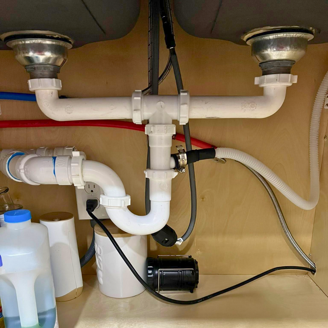 Under-sink drain lines and garbage disposal plumbing