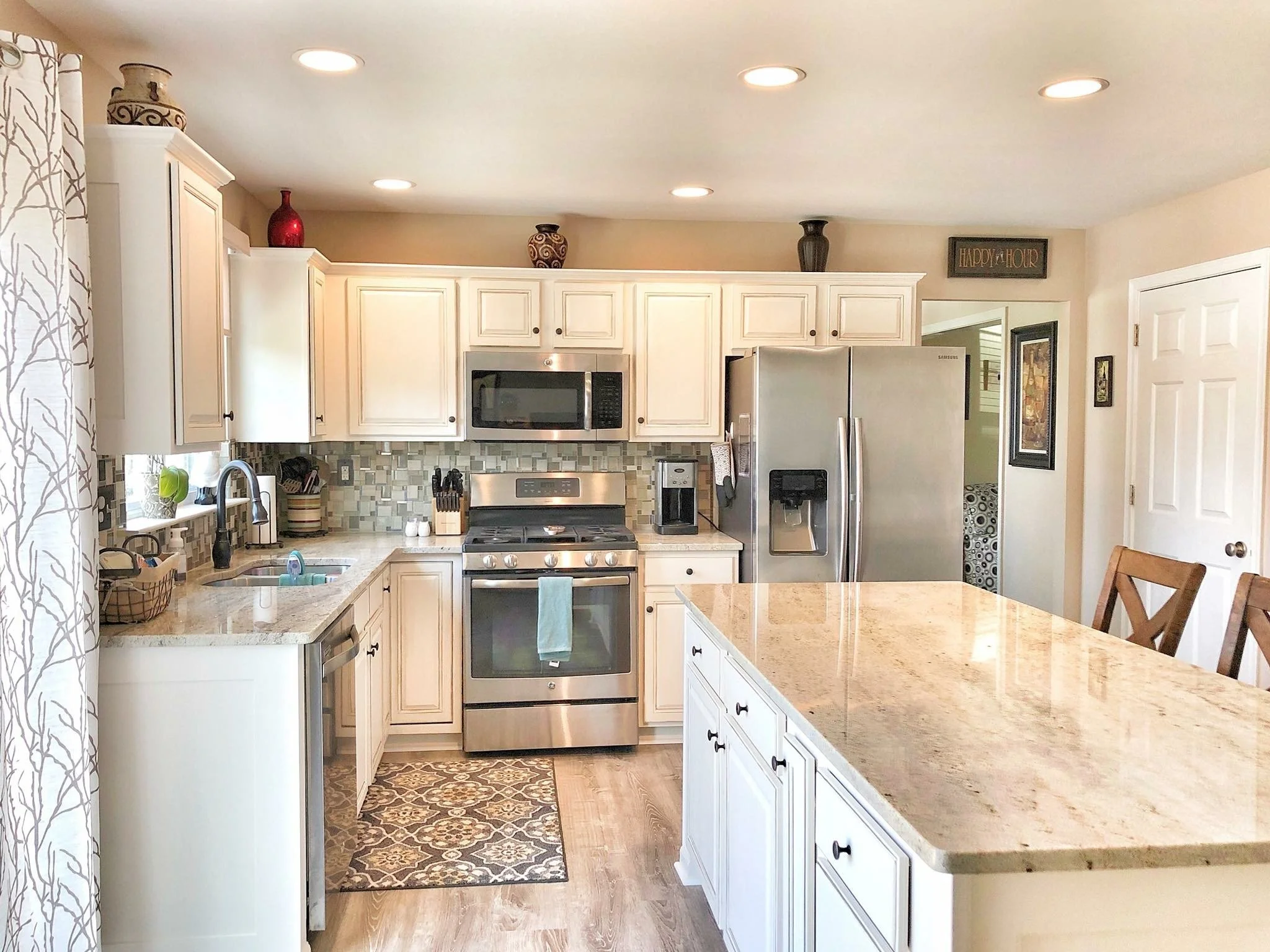 Stone slabs displayed in the showroom with warm neutral palettes