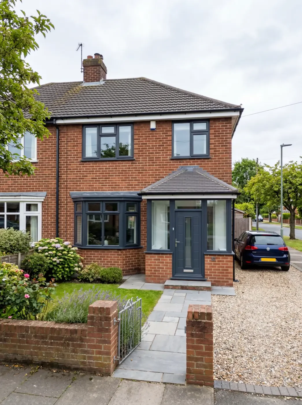 Dark entrance door and glazed porch