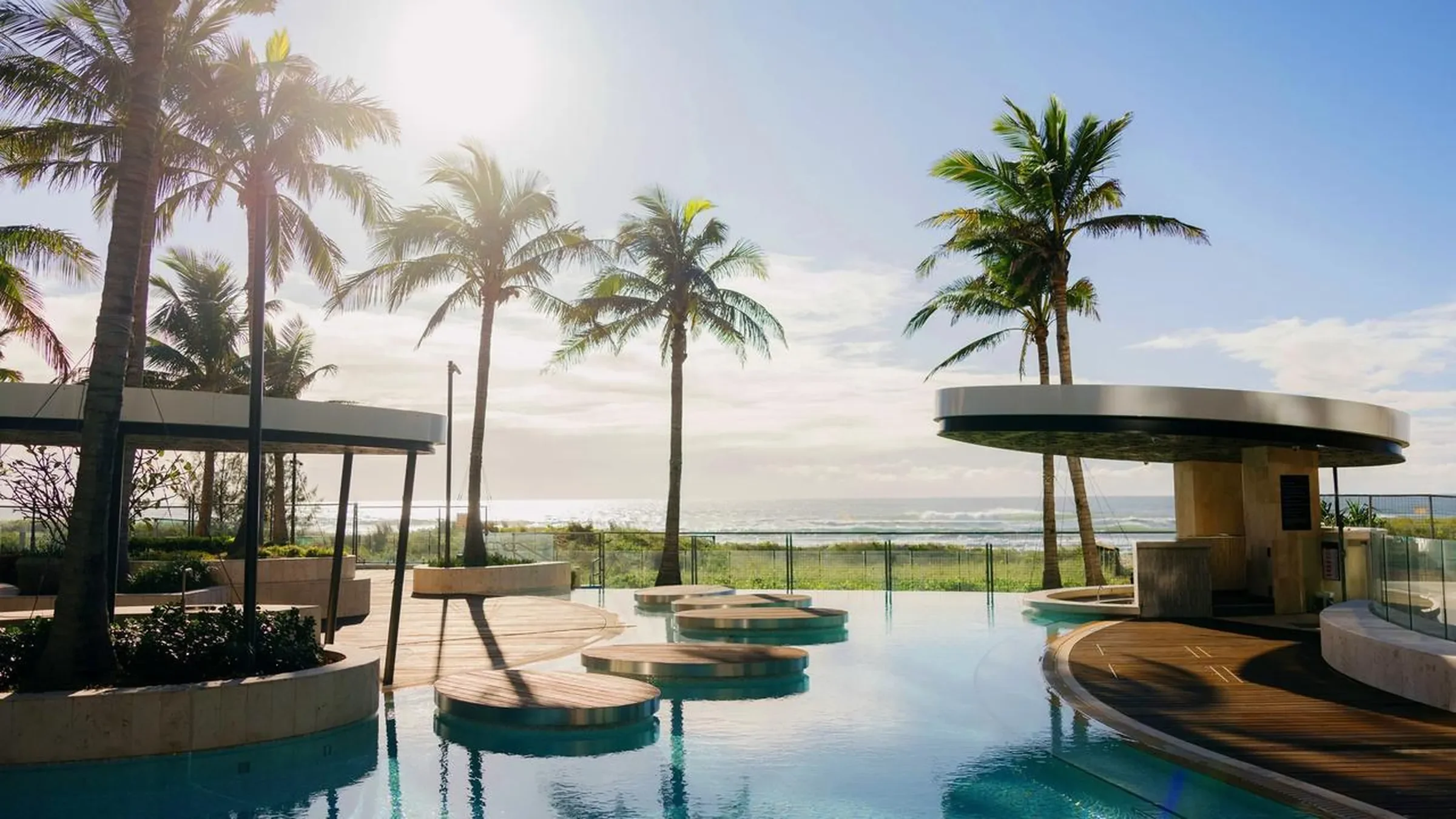 A coastal apartment complex at dusk, the kind of management rights business this finance funds
