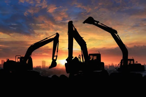 Excavators at construction site — chattel mortgage heavy equipment