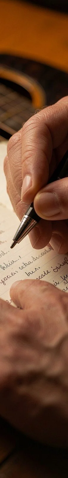 Hand writing song lyrics with a pen